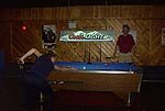 A couple of guys hanging out and shooting pool!